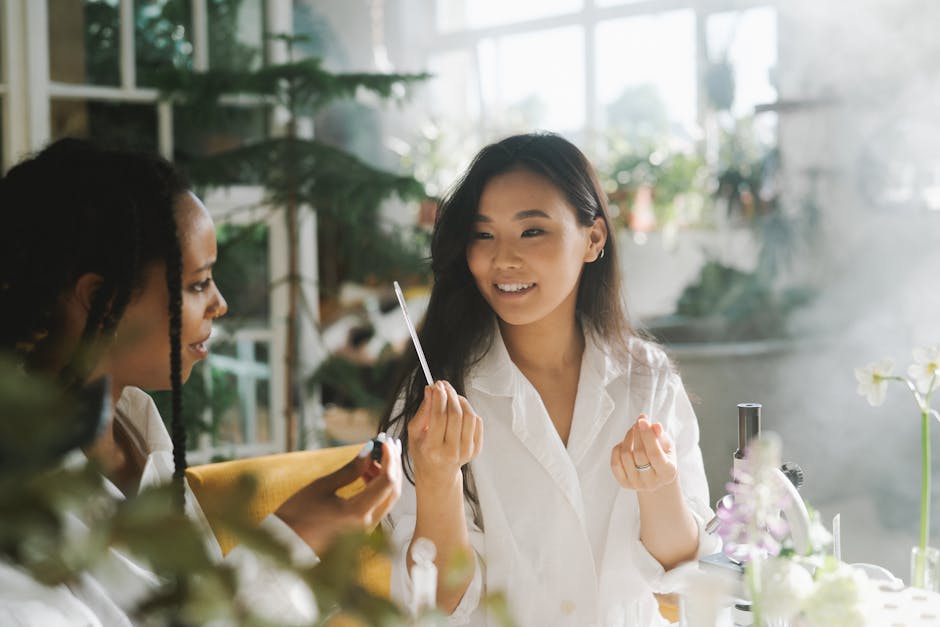 Two women engaging in a scientific experiment indoors with natural light.