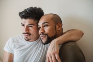 Portrait of a loving couple embracing, showcasing tenderness and connection indoors.