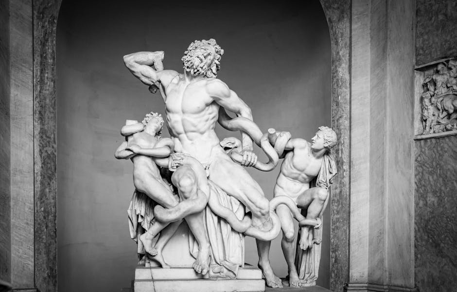 Black and white photo of the famous Laocoön and His Sons marble statue, highlighting intricate Roman art details.
