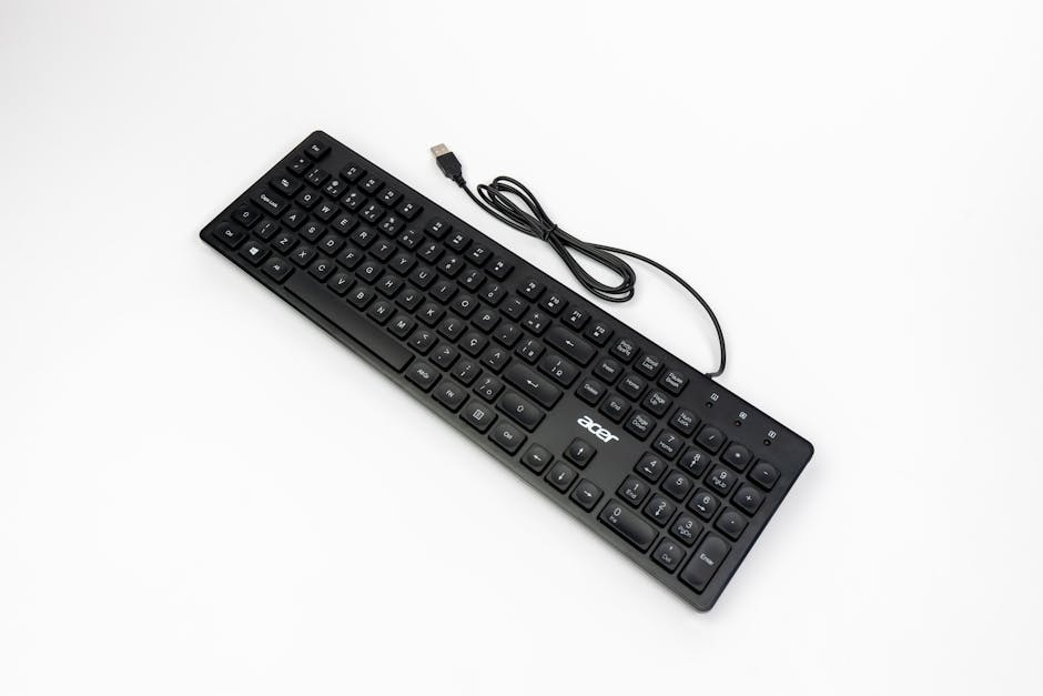 A sleek black USB keyboard on a white background, showcasing modern technology and design.
