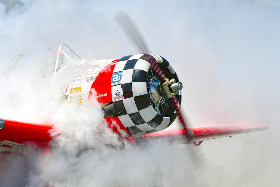 A T-6 Texan propeller airplane surrounded by smoke during takeoff in Titusville, Florida.