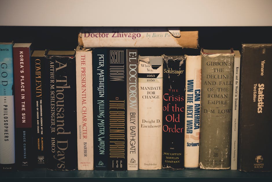 Close-up of classic literature on a wooden bookshelf, providing a vintage and educational feel.