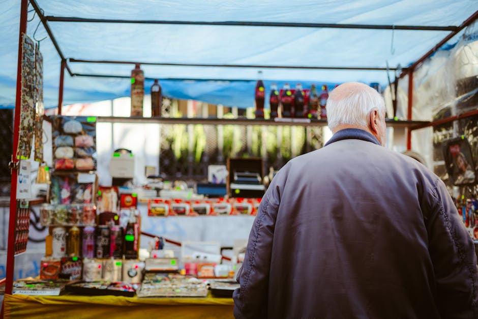 Senior adult browsing an outdoor market stall in Buenos Aires, Argentina.