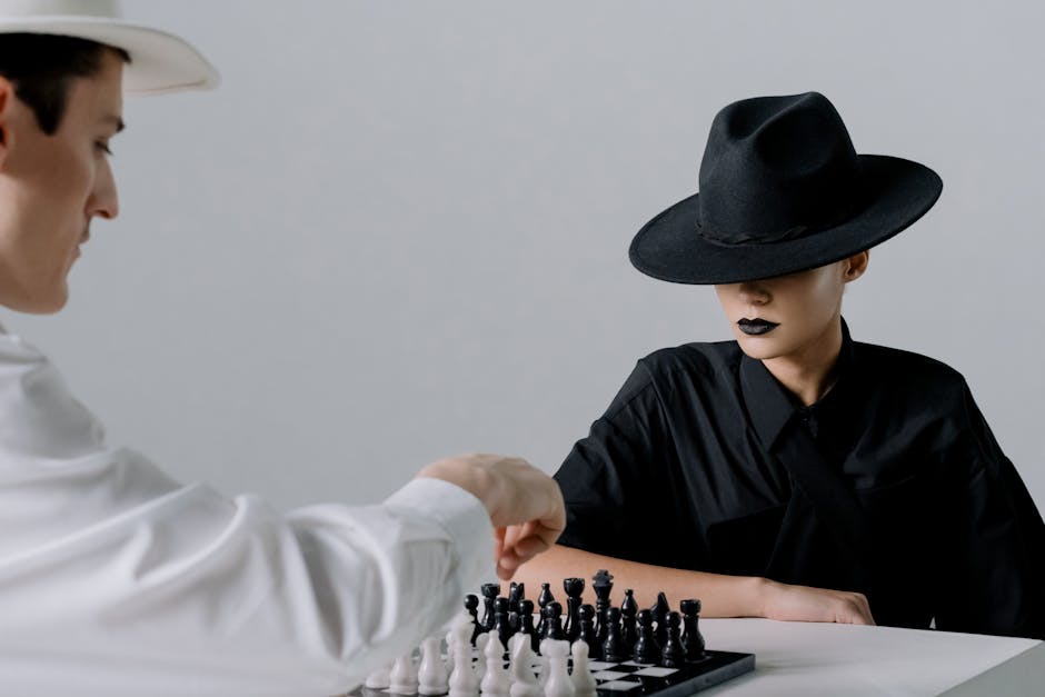 Two players in contrasting outfits face off over a chessboard, embodying strategy and drama.