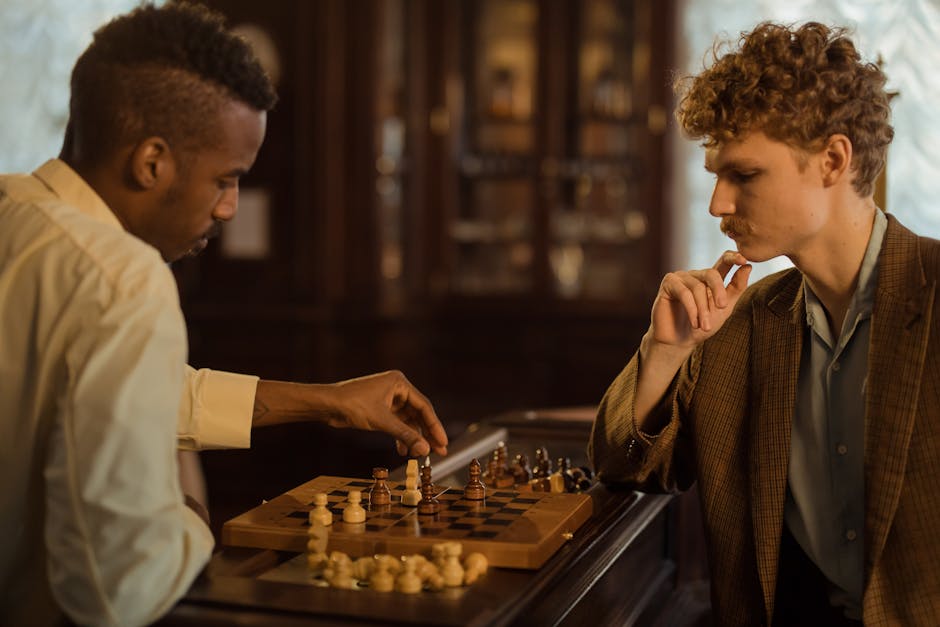 Two men concentrate on a chess game in a vintage indoor setting.