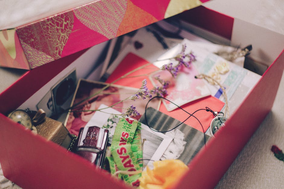 A colorful box filled with photographs, papers, and sentimental items, evoking nostalgia.