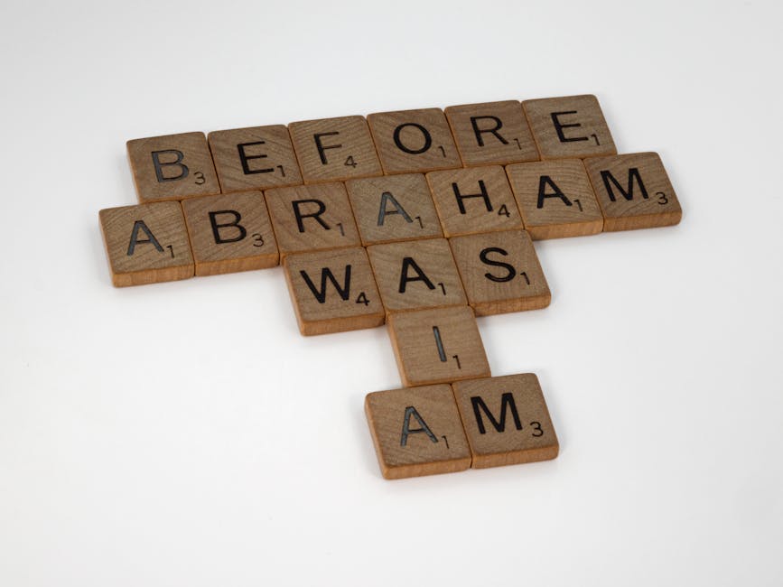 Wooden letter tiles on a white background forming the phrase 'Before Abraham Was I Am'.