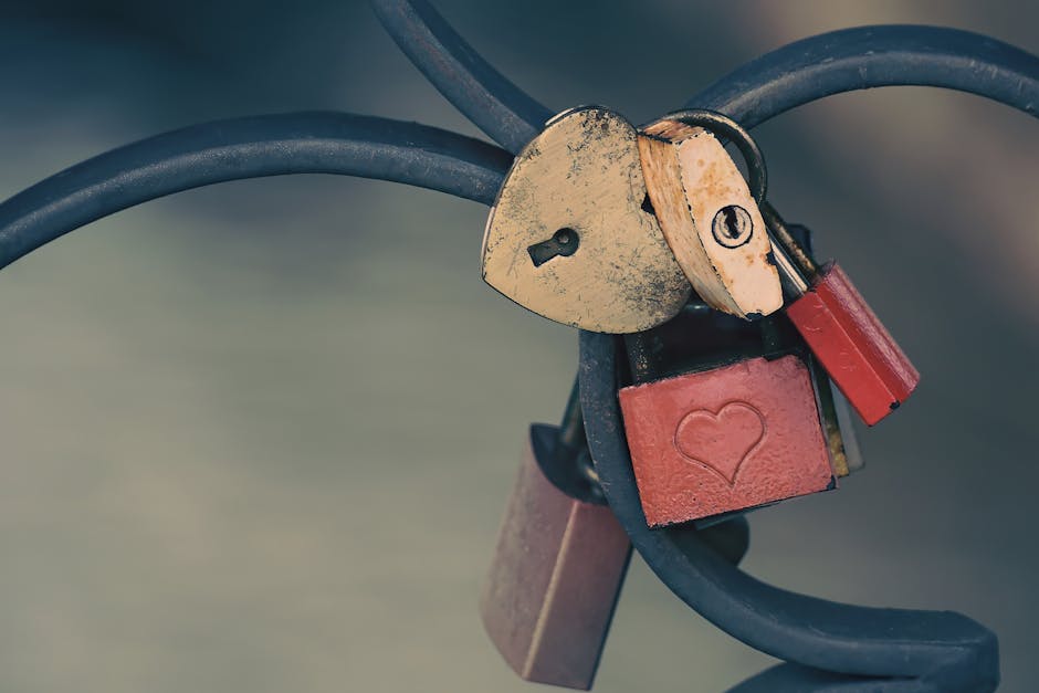 A collection of heart-shaped padlocks on a fence, symbolizing promises of love and commitment.