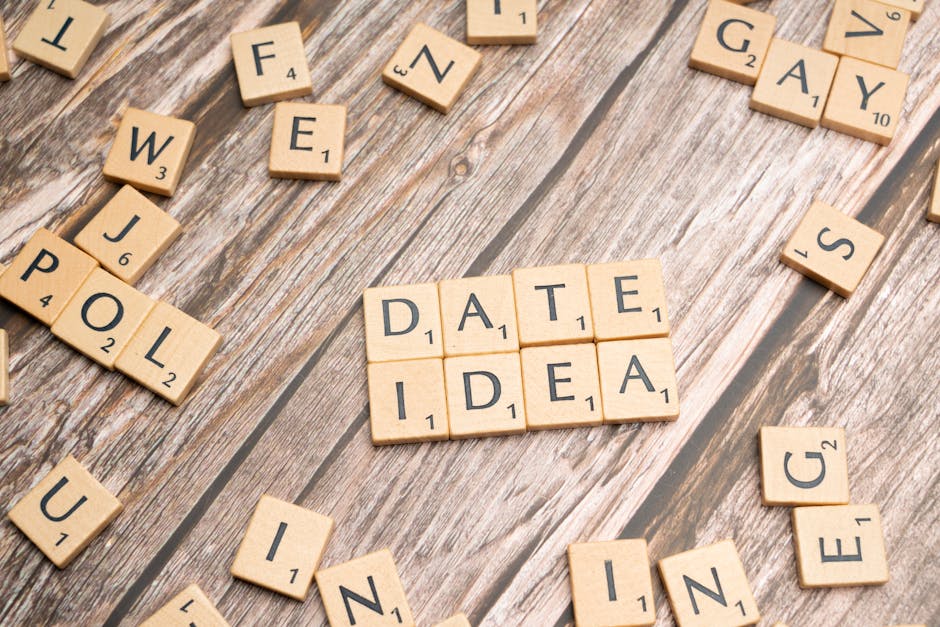 Letter tiles spelling 'Date Idea' on a wooden surface, suggesting creative meeting plans.