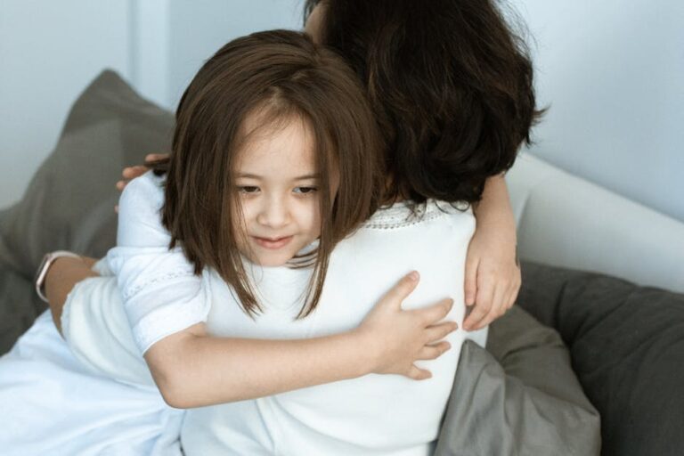 A touching moment of love and affection between a mother and her daughter sharing a warm hug.