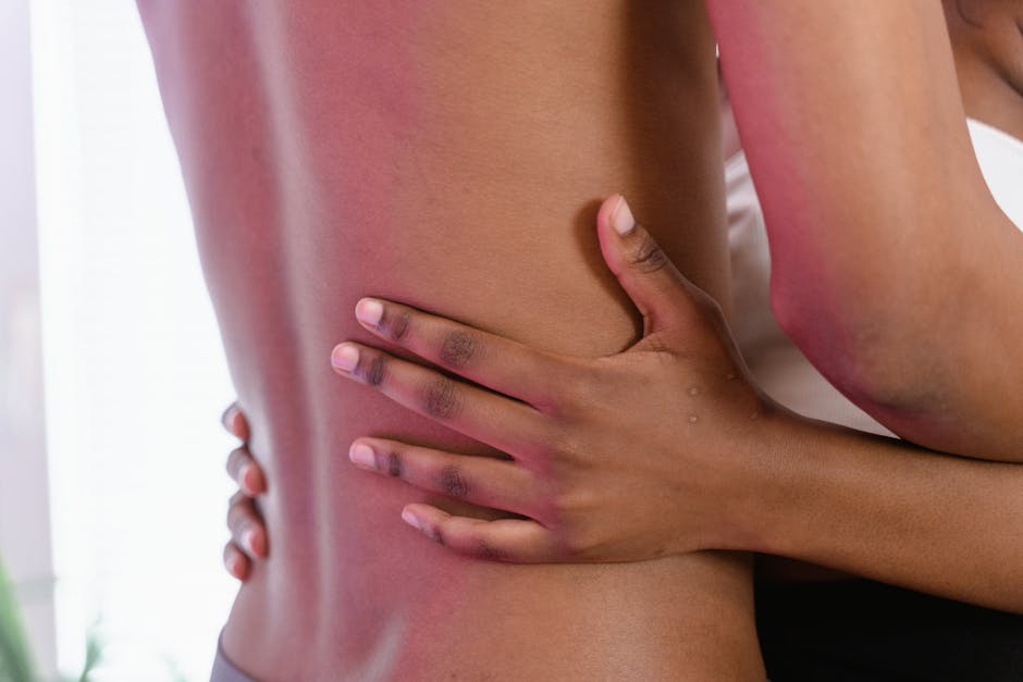 A close-up shot of an intimate and gentle embrace showcasing human connection.