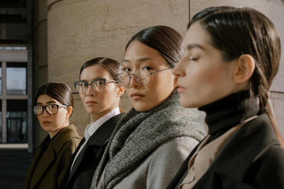A stylish group of businesswomen standing together in an urban environment.