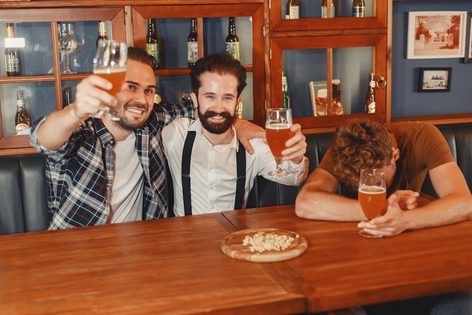 Lively group of friends enjoying beers at a bar with a relaxed atmosphere.