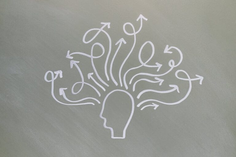 Conceptual chalk drawing illustrating mental health challenges with arrows representing thoughts.