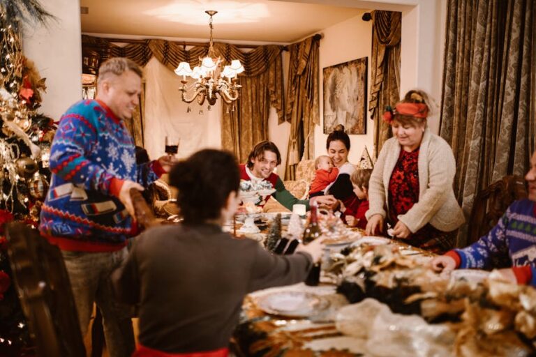 A joyful family gathering around a table decorated for Christmas, sharing food and happiness.