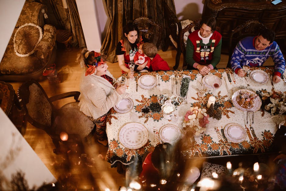 A joyful family enjoying a festive meal together at a beautifully decorated holiday table.