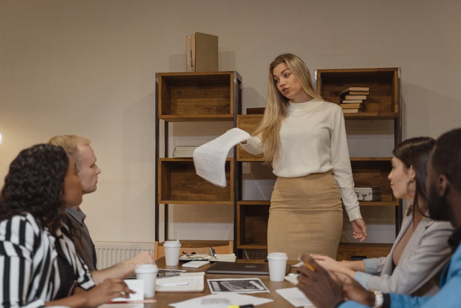 A diverse group of professionals having an engaging discussion in a modern office setting.