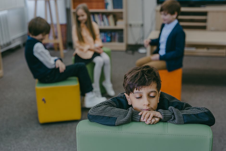 Child feeling isolated in a classroom while peers interact. Emphasizes themes of loneliness and social dynamics.