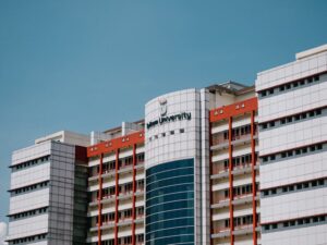 Low angle shot of Telkom University's building facade in Bandung.